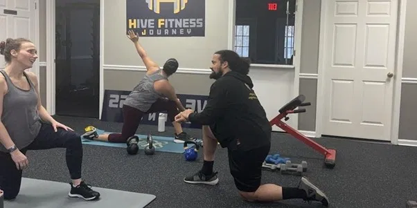 Adults practicing strength and mobility